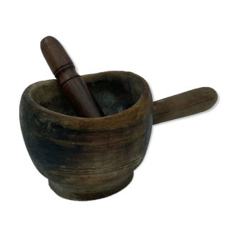 Old wooden mortar with its pestle 1970 brutalist art