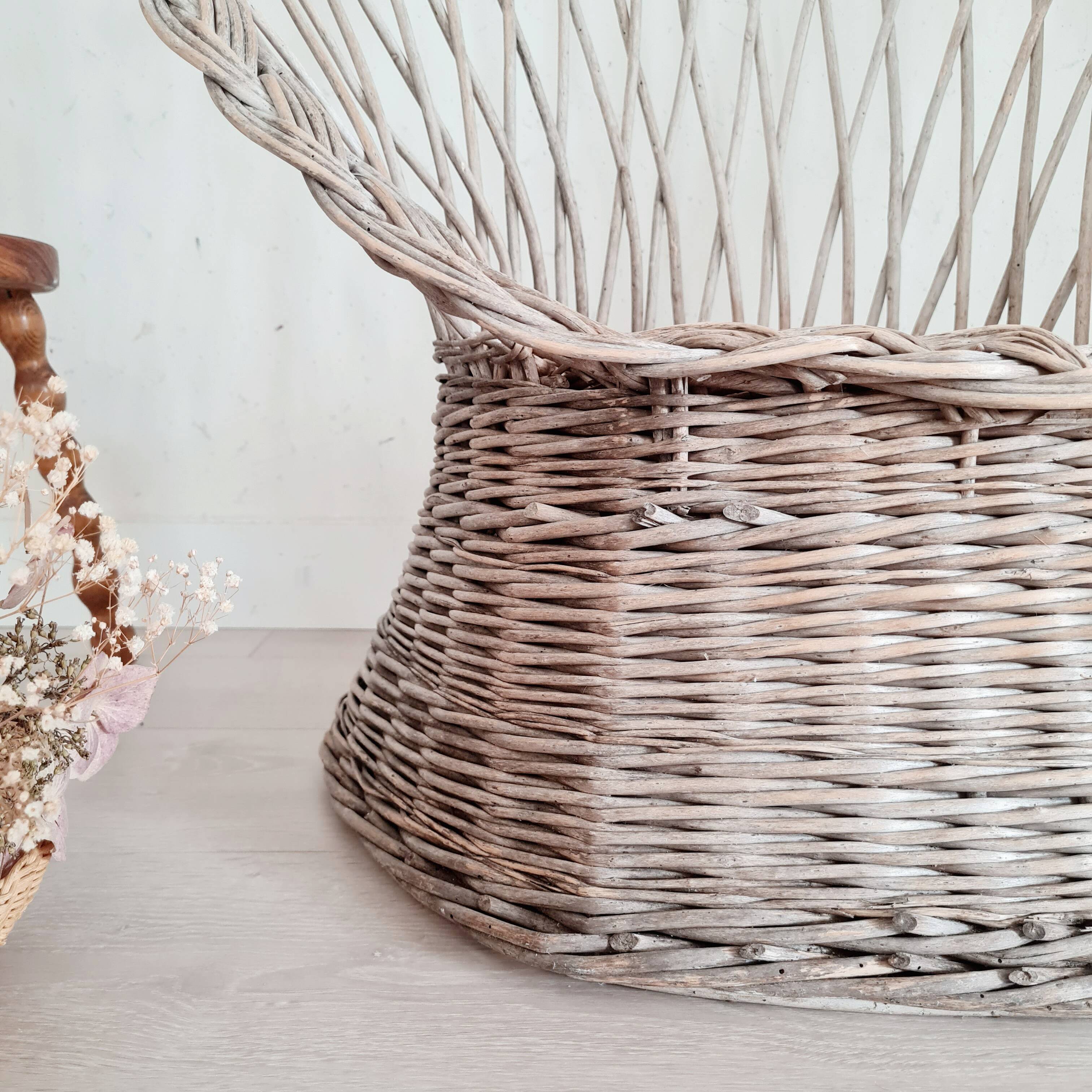 Antique armchair in gray woven wicker