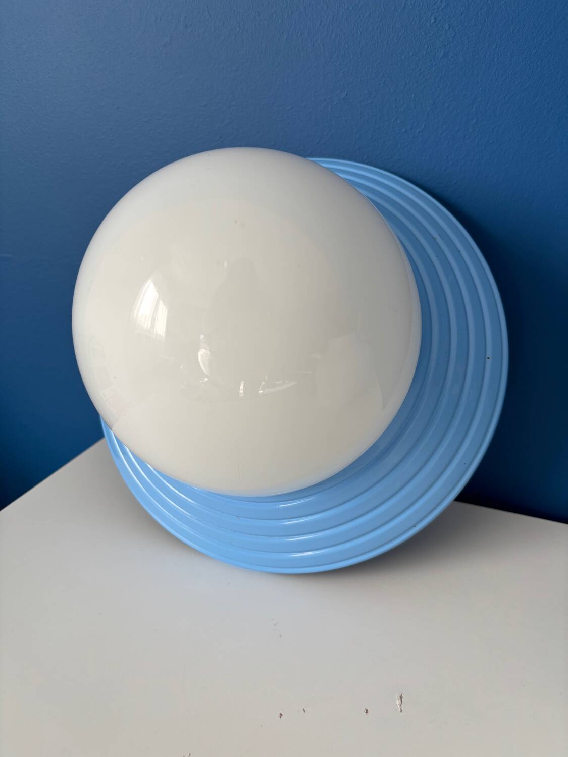 Vintage blue metal wall light with opaline globe – design luminaire