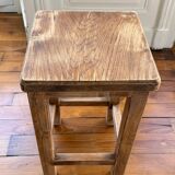 Brutalist stool in raw wood with a weathered effect.