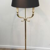 Floor lamp of parquet in neoclassical style in brass with dolphin heads. french work of the ma