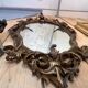 Large gilded wooden mirror, richly carved with winged dragons, 19th century