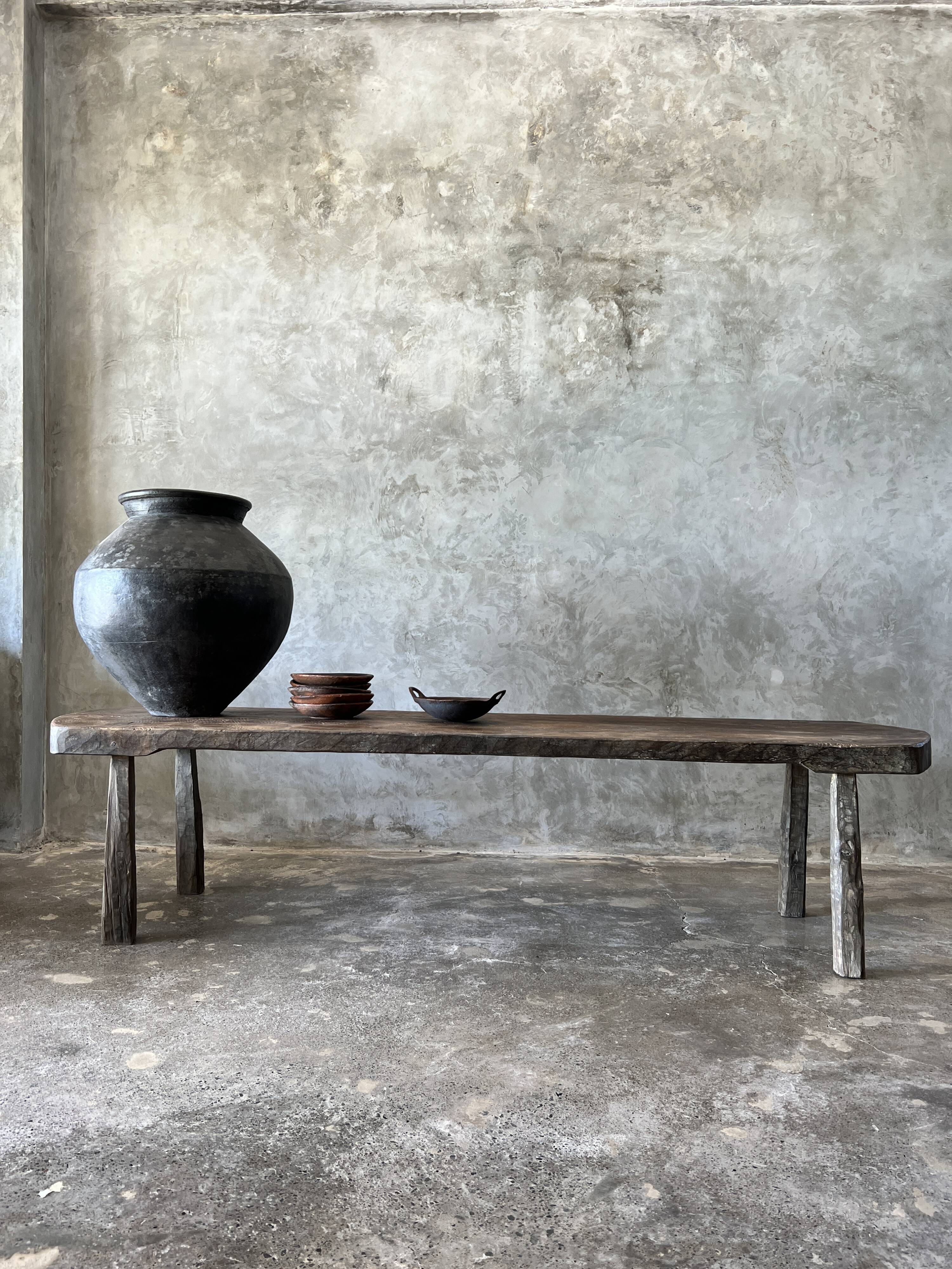 Large rounded coffee table in old Asian teak