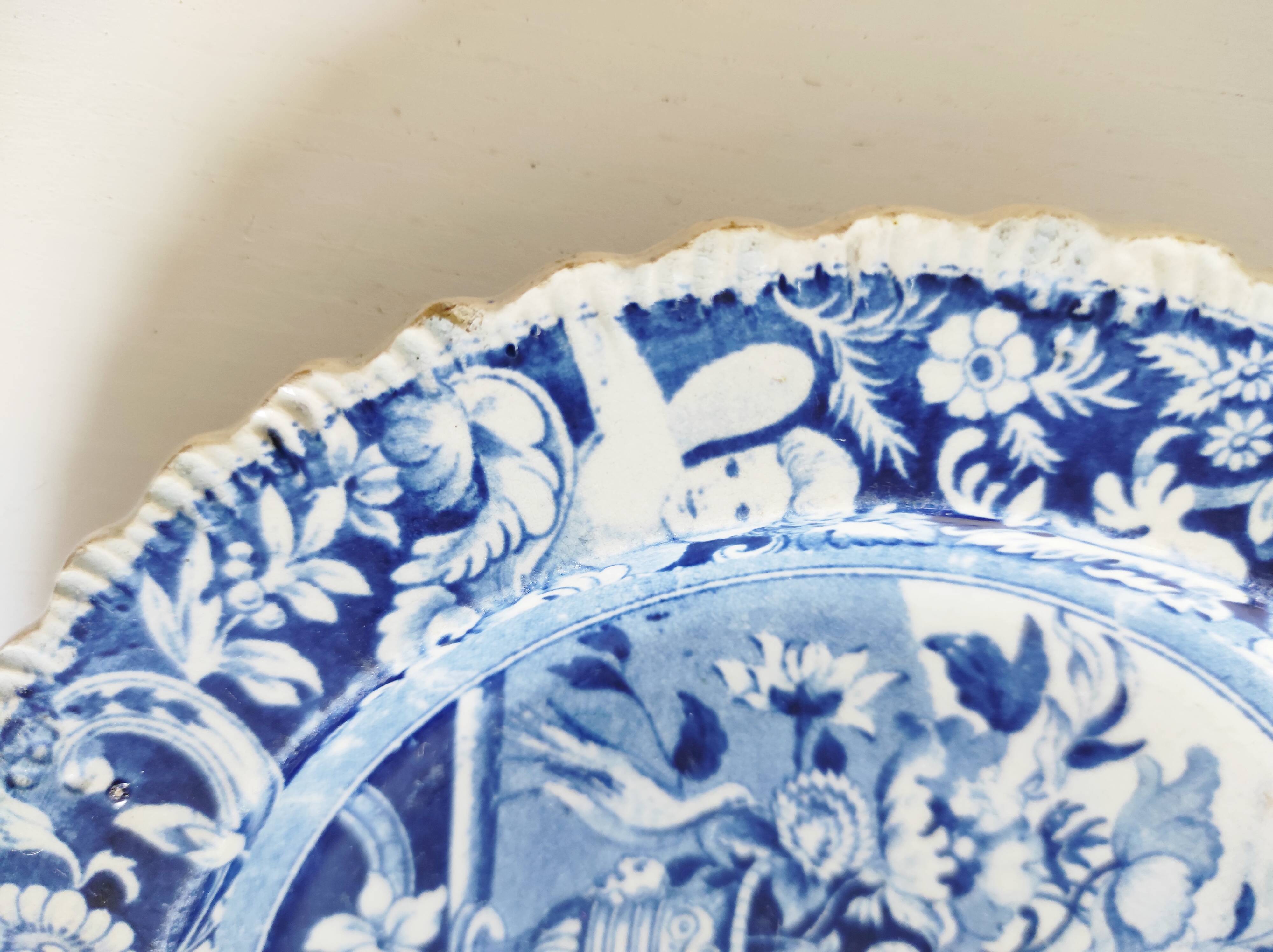 Five 19th century Calais earthenware plates with a romantic gallant couple decor