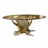 Round glass and brass table by designers Richard and Isabelle Faure