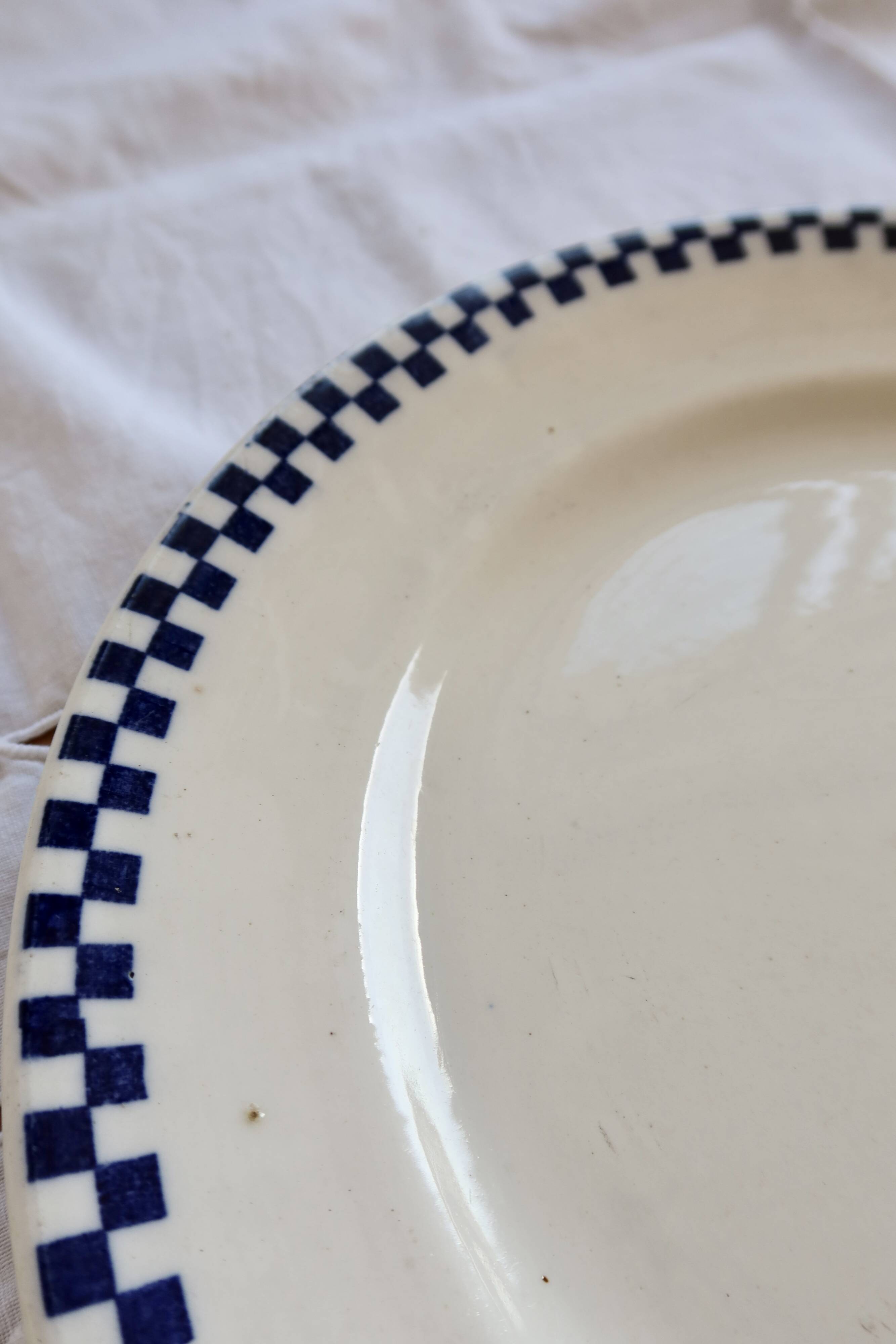 Round serving dish, old ironstone from Salins - Checkerboard pattern