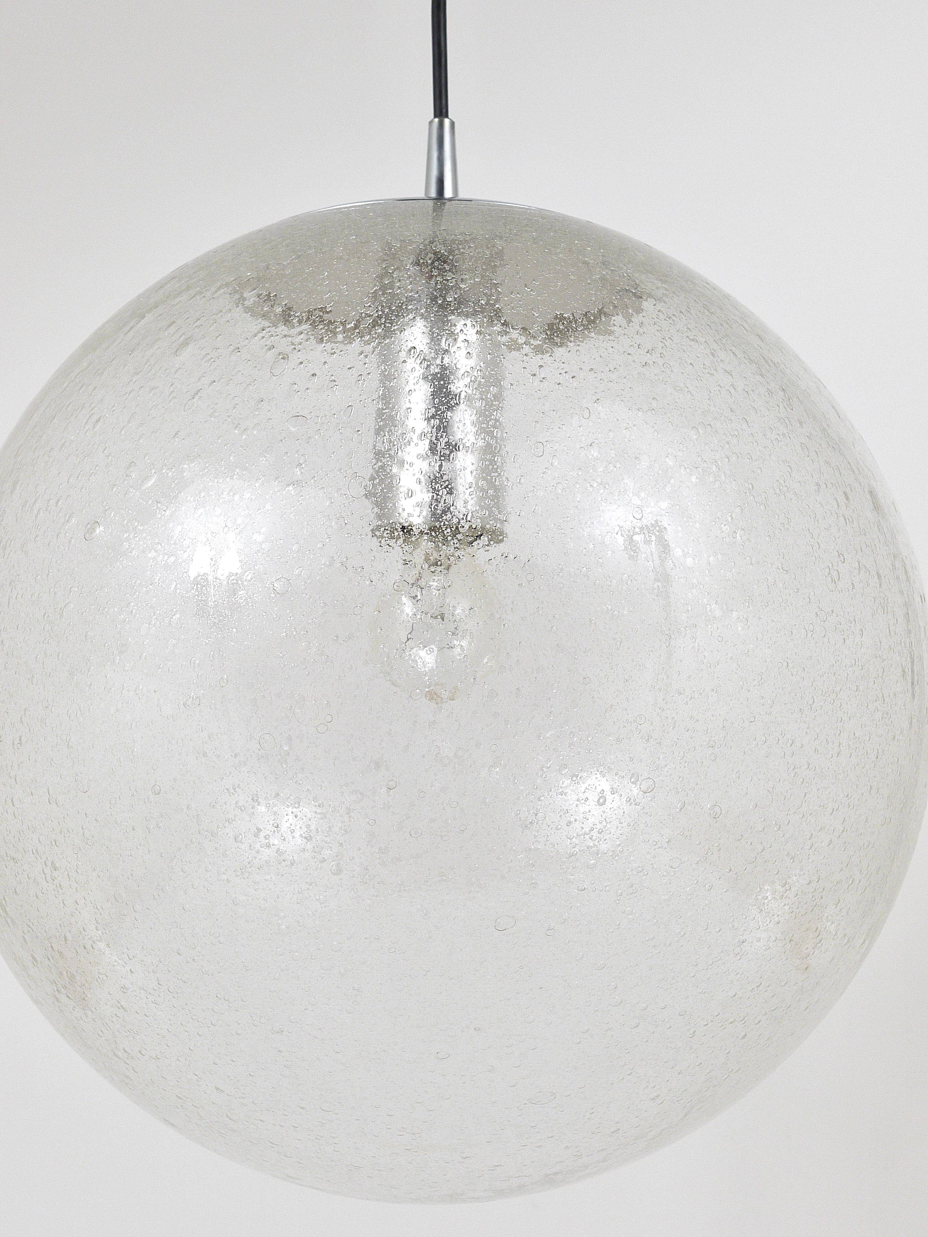Large glass globe pendant light with bubbles and chrome by Peil & Putzler, Germany, 1970s.