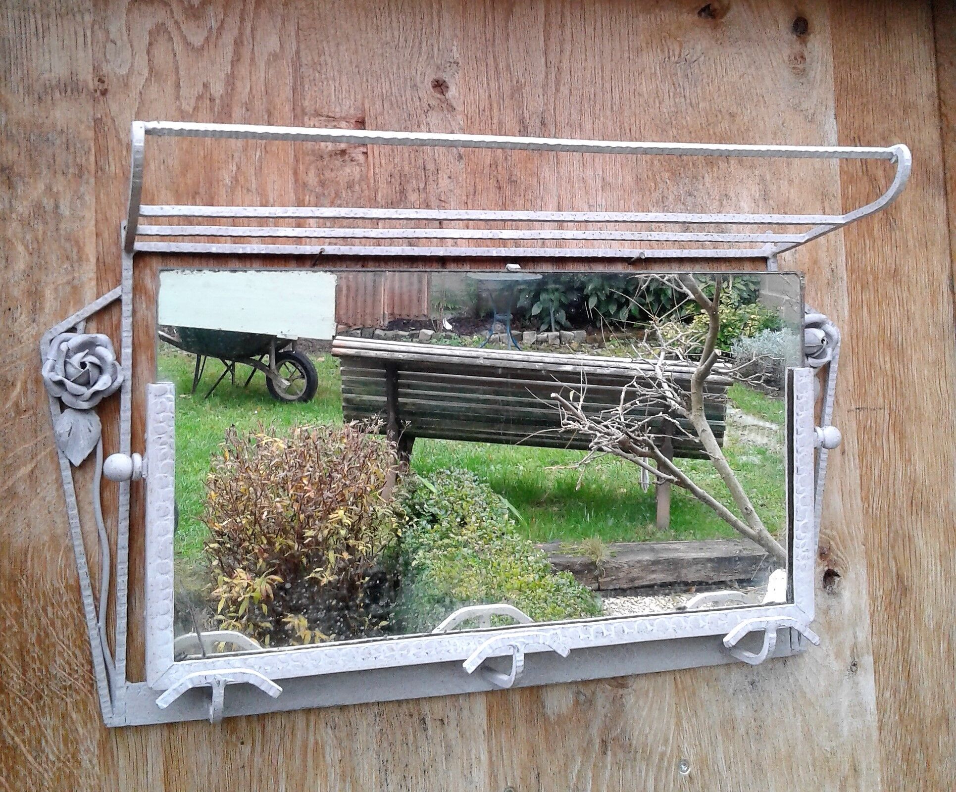 Former Wall coat hangers painted in gray iron