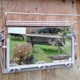 Former Wall coat hangers painted in gray iron