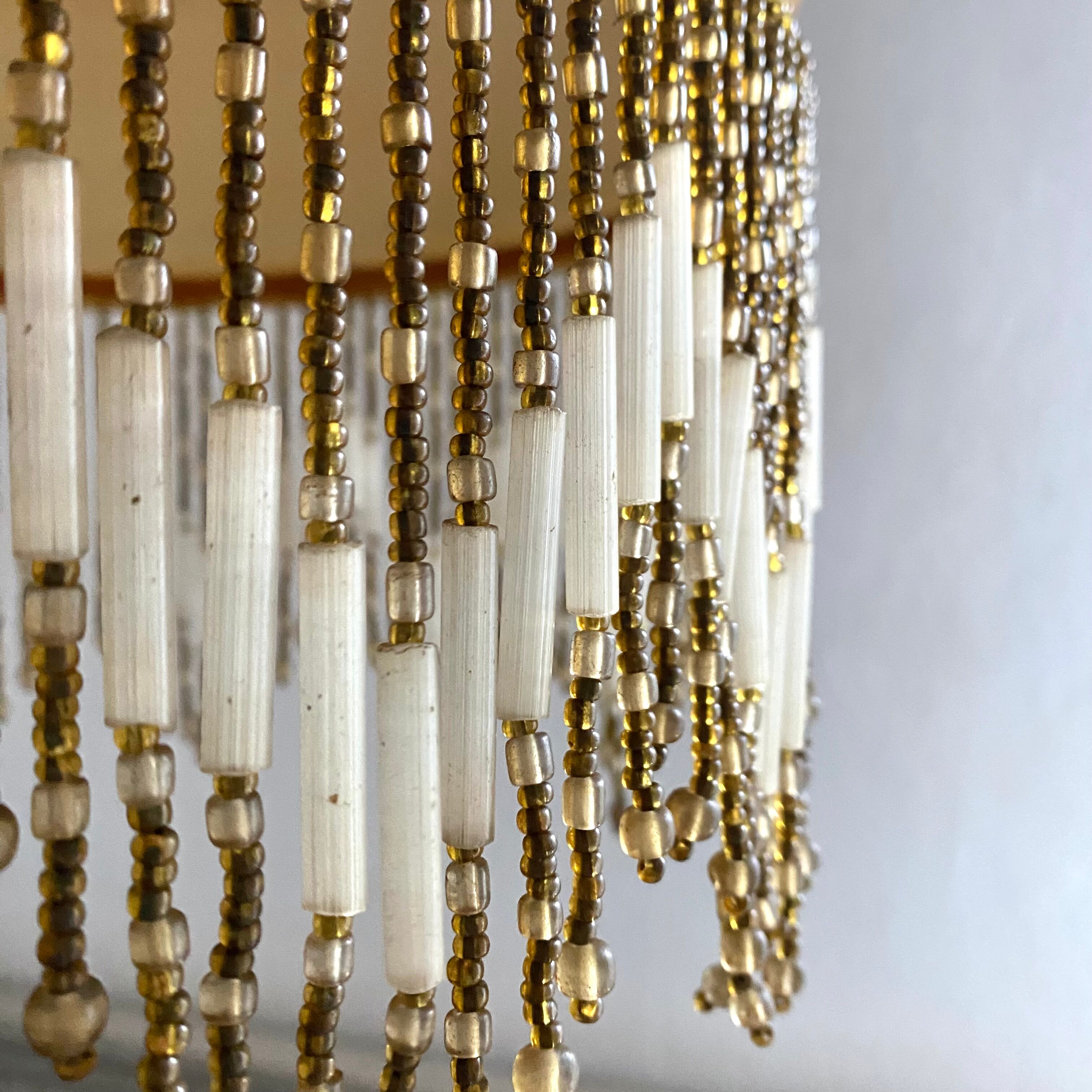 Amber polished glass and pearl suspension