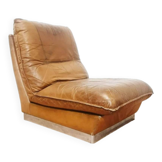 70s lounge chair in camel leather