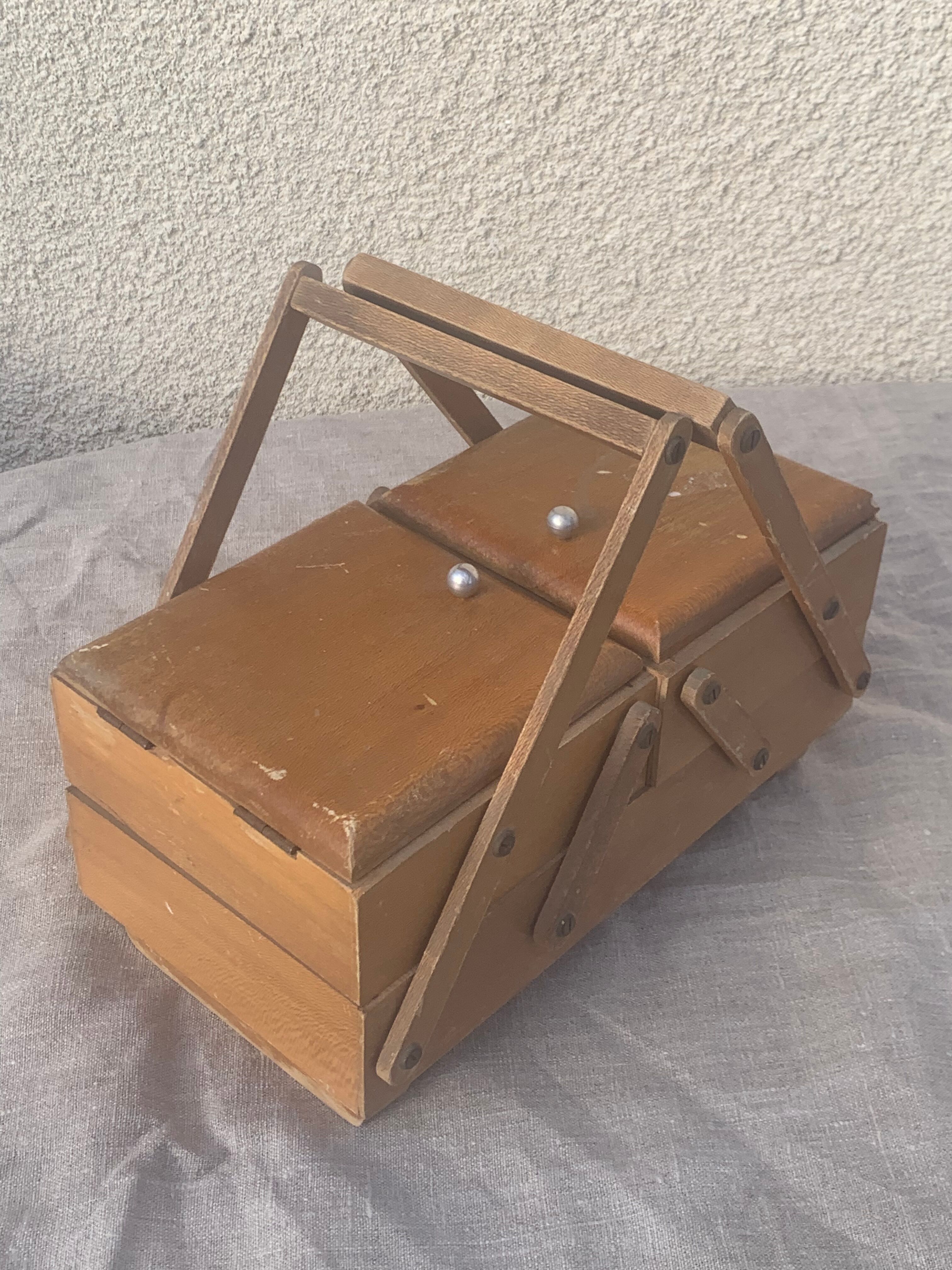 Sewing box in old varnished wood