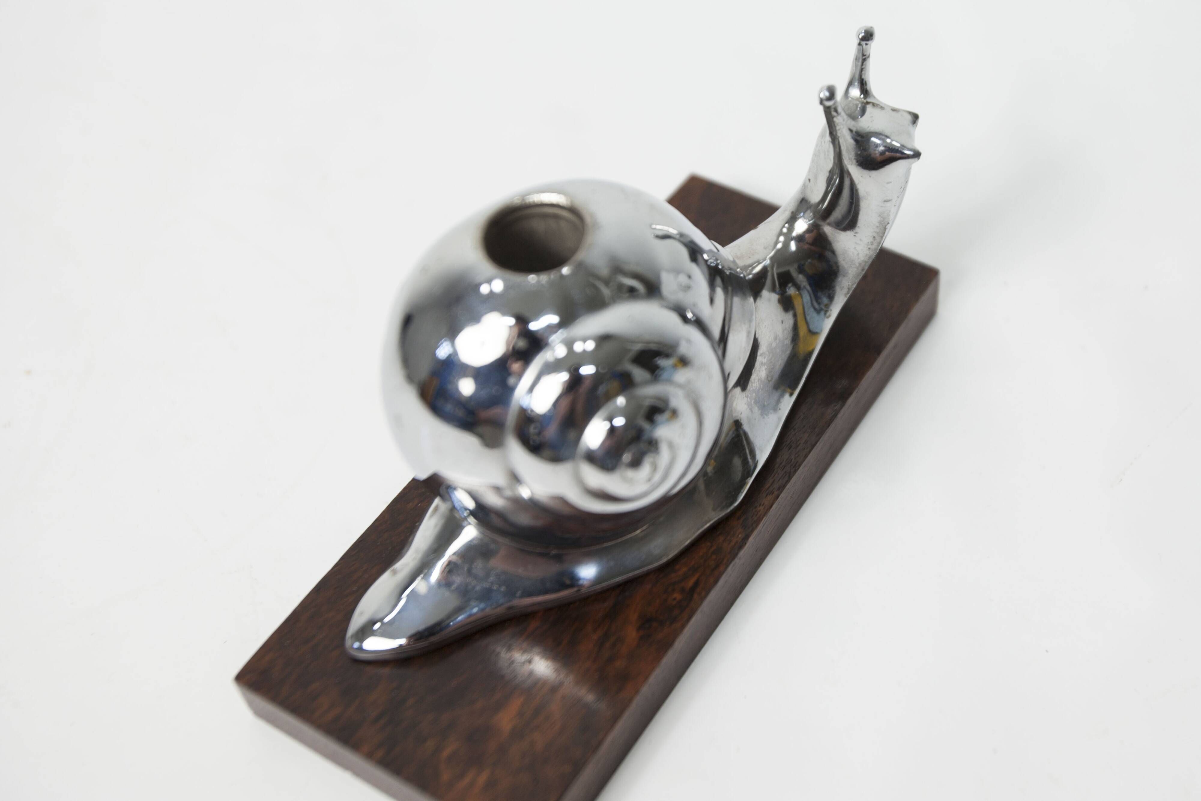 Silver snail candlestick on a teak base 1960