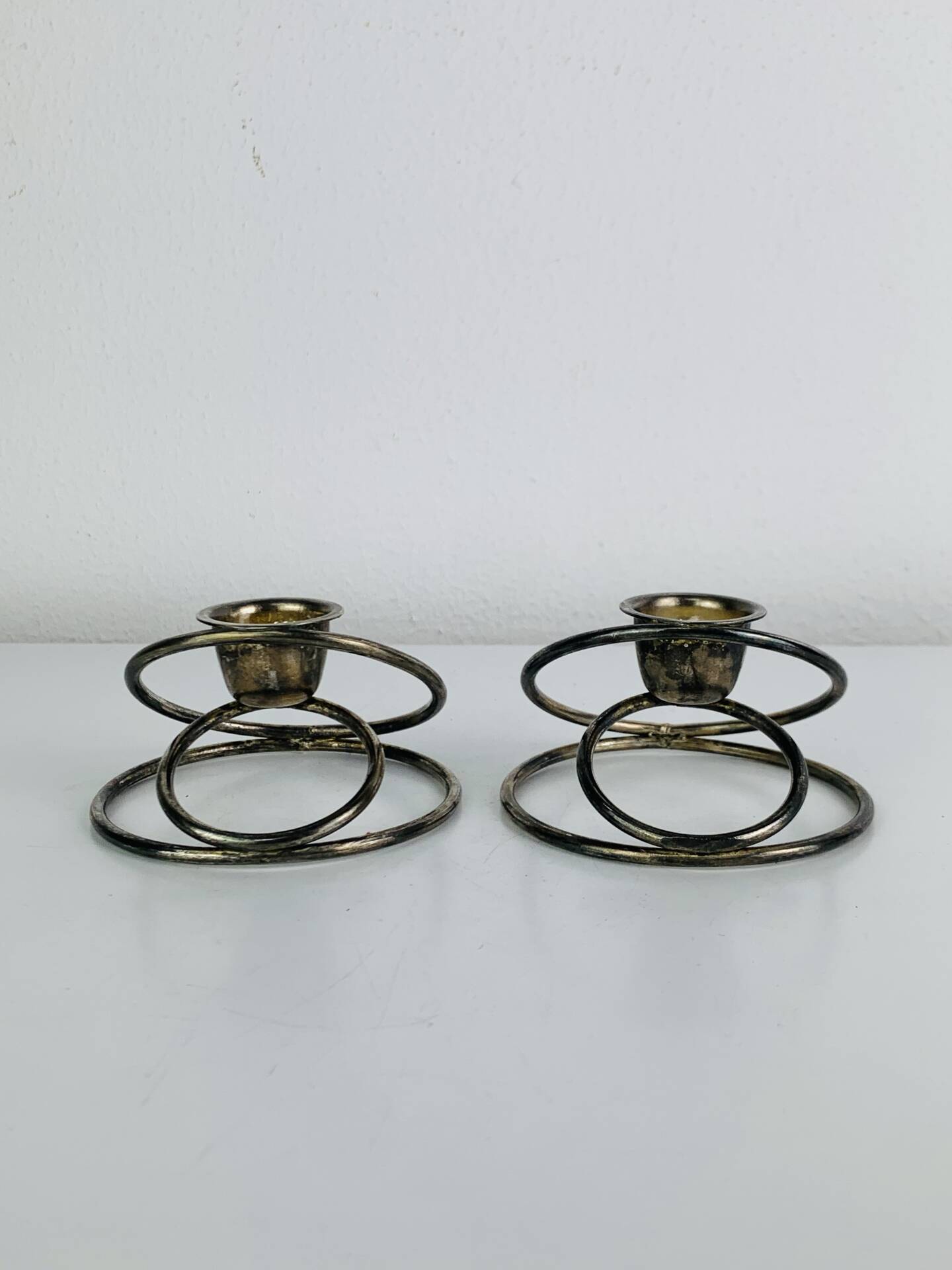 Pair of silver-plated metal candlesticks, vintage