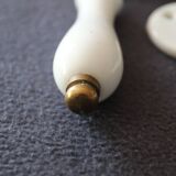 Set of two porcelain door handles with two rosettes