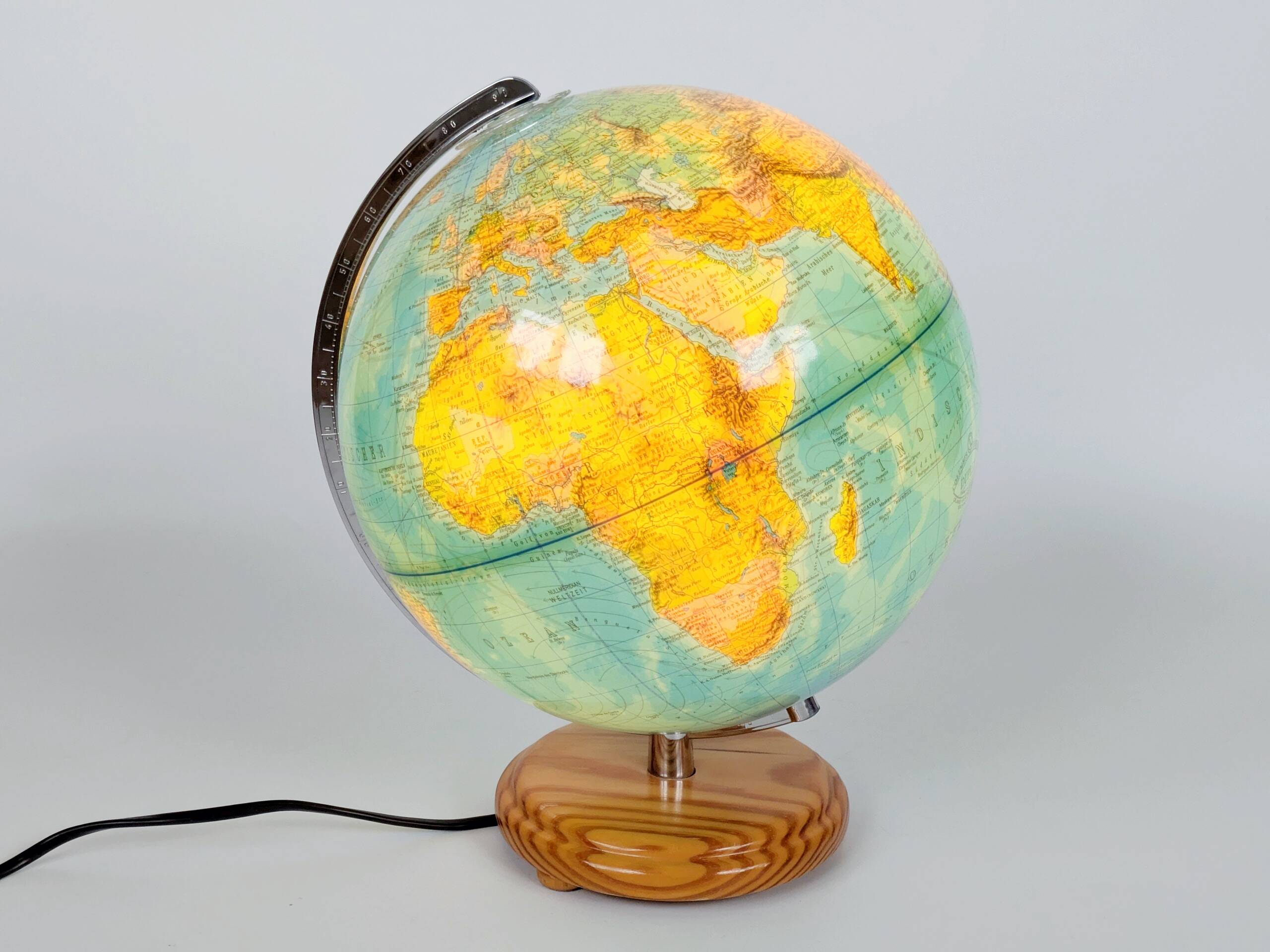 Columbus Duplex illuminated globe on a wooden base, 1980s
