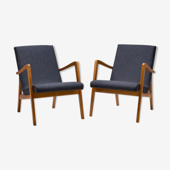 A pair of 300-138 armchairs from the 60s