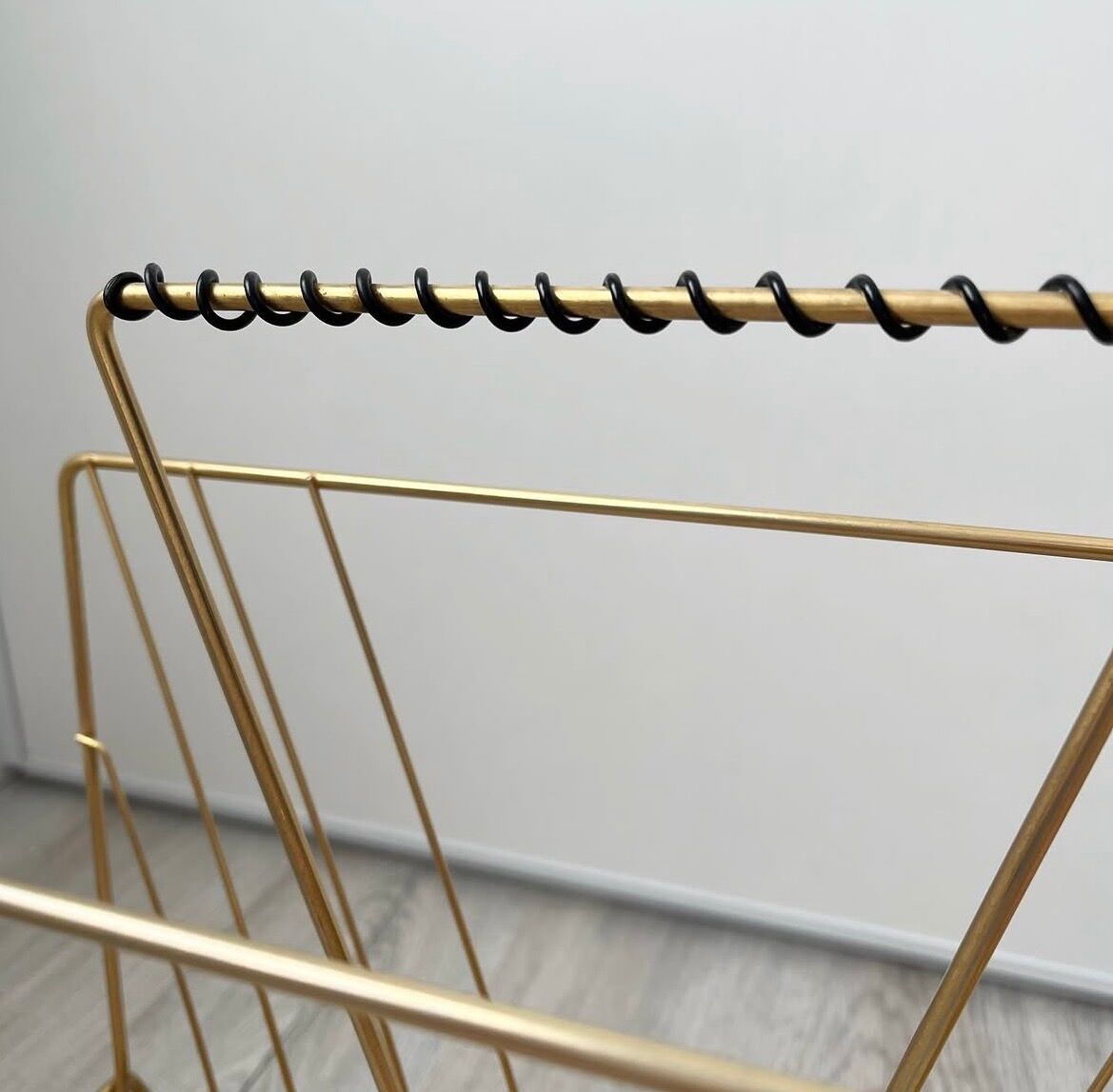 Vintage gold metal magazine rack