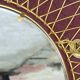 Vintage 1950s sun mirror in gold metal.
