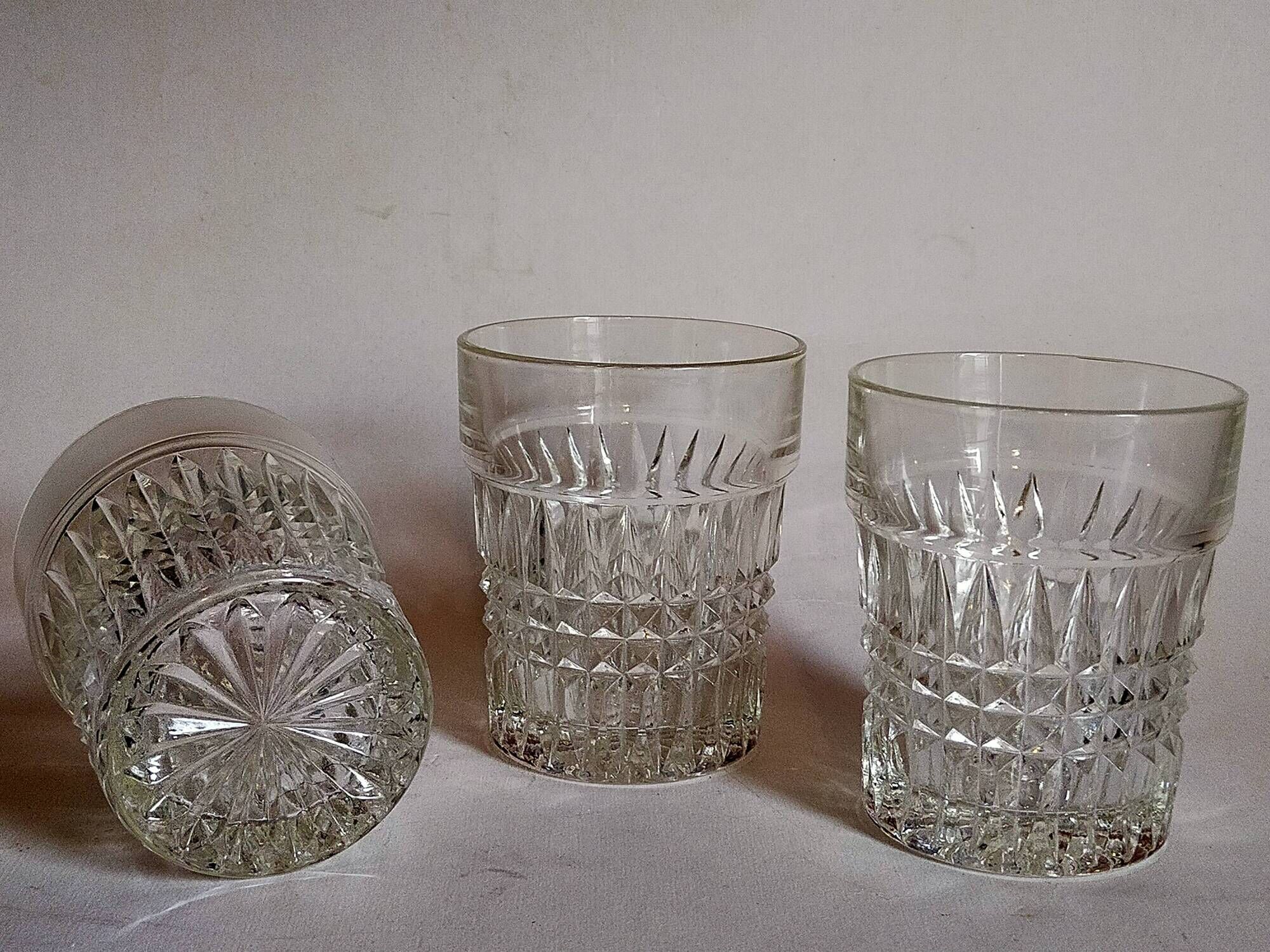 Trio of vintage whiskey glasses in pimpled glass