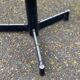 Round bistro table with a central pedestal, gold marble effect and black steel, 60cm.
