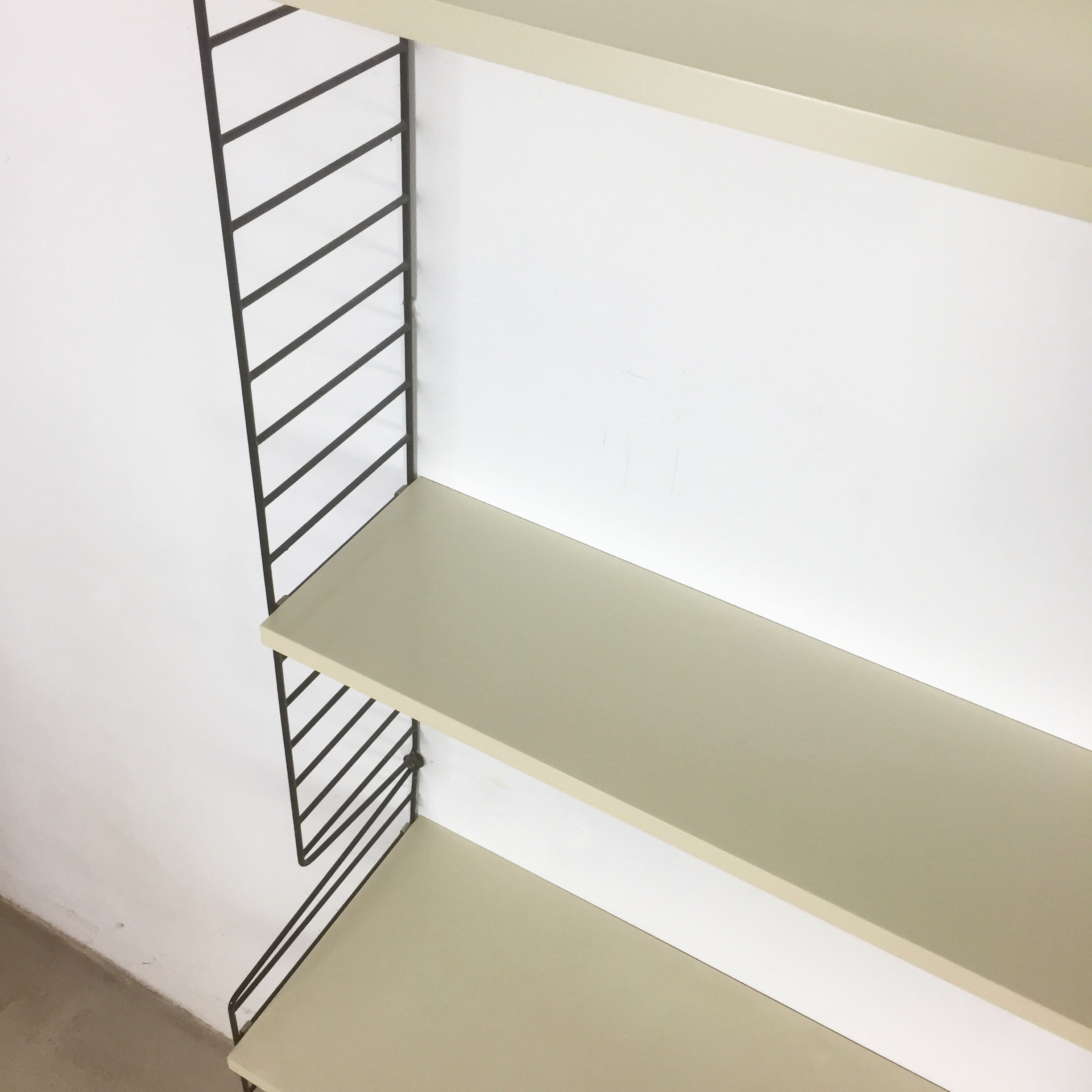 Swedish white shelves by Nisse Strinning for String of the 1960s