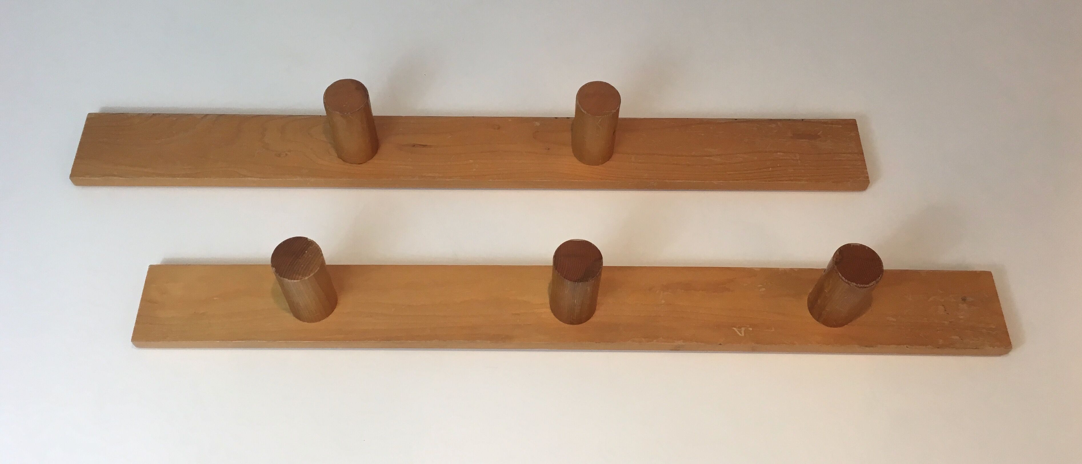 Charlotte Perriand, pair of fir wall coat racks, French work, around 1970