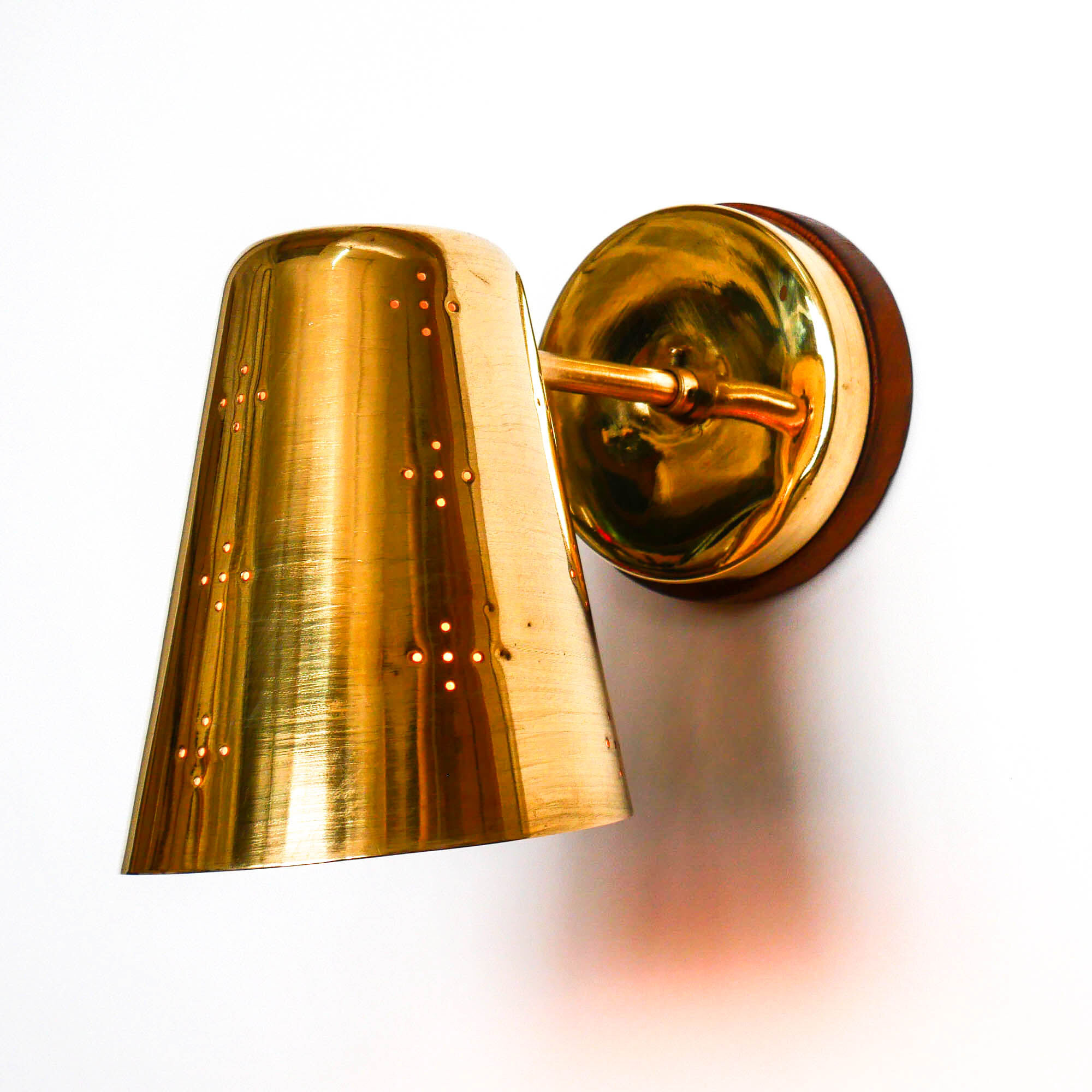 Old conical brass wall lamp, perforated lampshade