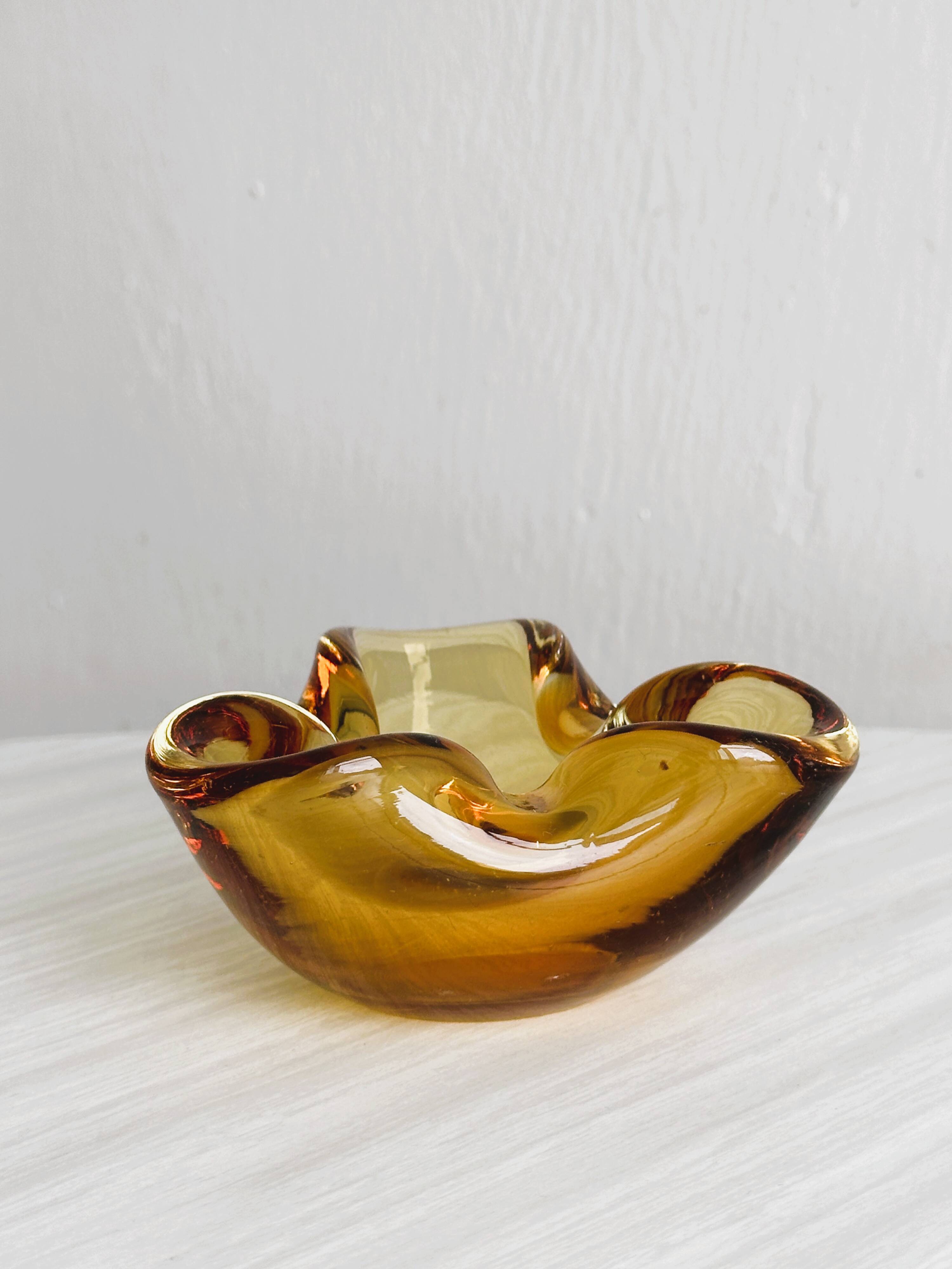 Thick amber yellow glass ashtray