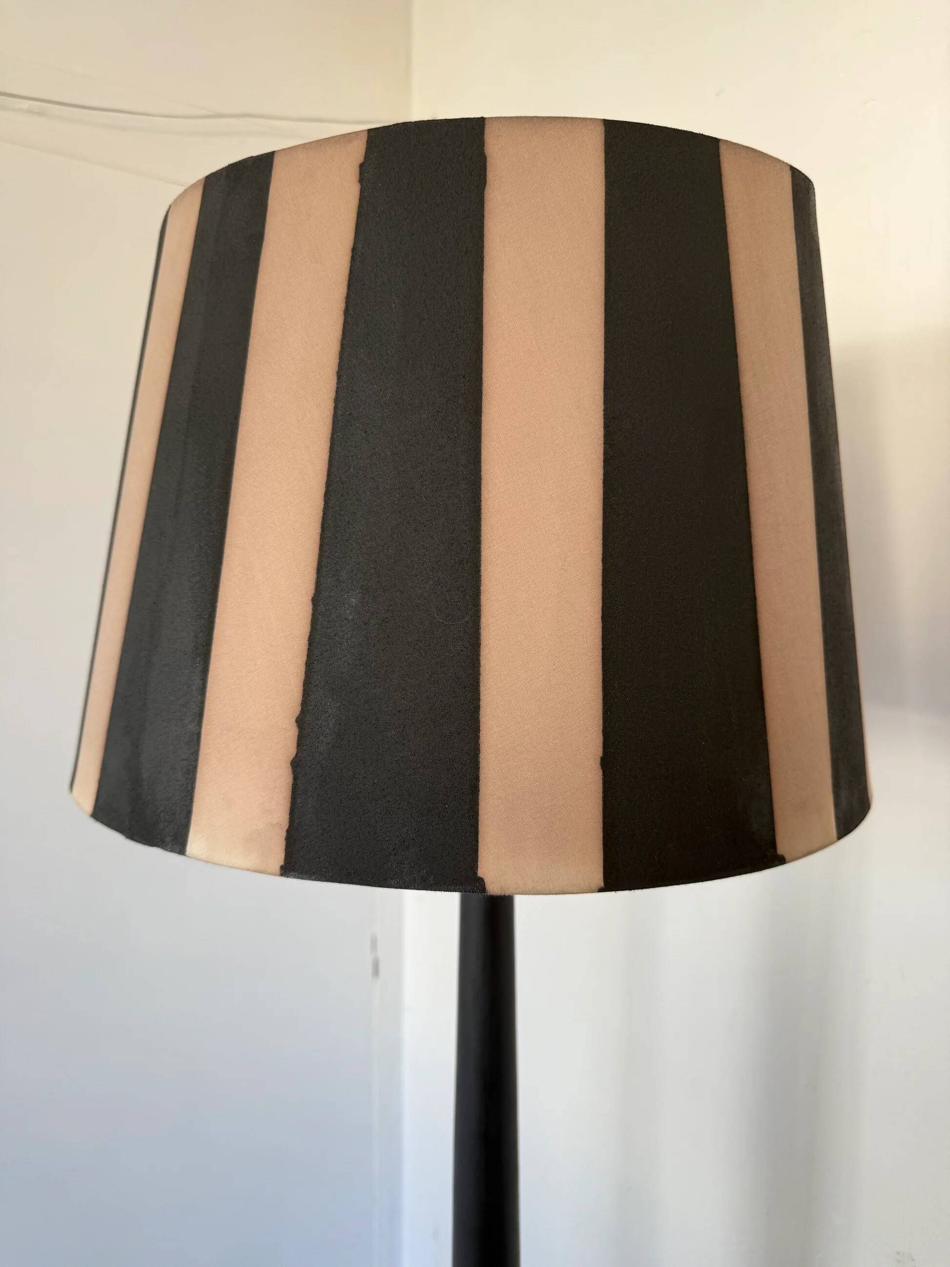 Vintage floor lamp in black patinated wood and striped lampshade