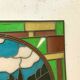 Art Deco stained glass window decorated with a 20th century church steeple