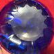 Series of 3 blue glass vases in the shape of a purse, 11, 13 and 17 cm