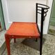 Chair with wooden seat and rare steel back