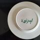 Plate decorated with yellow and green flower, signed Kerbigot.