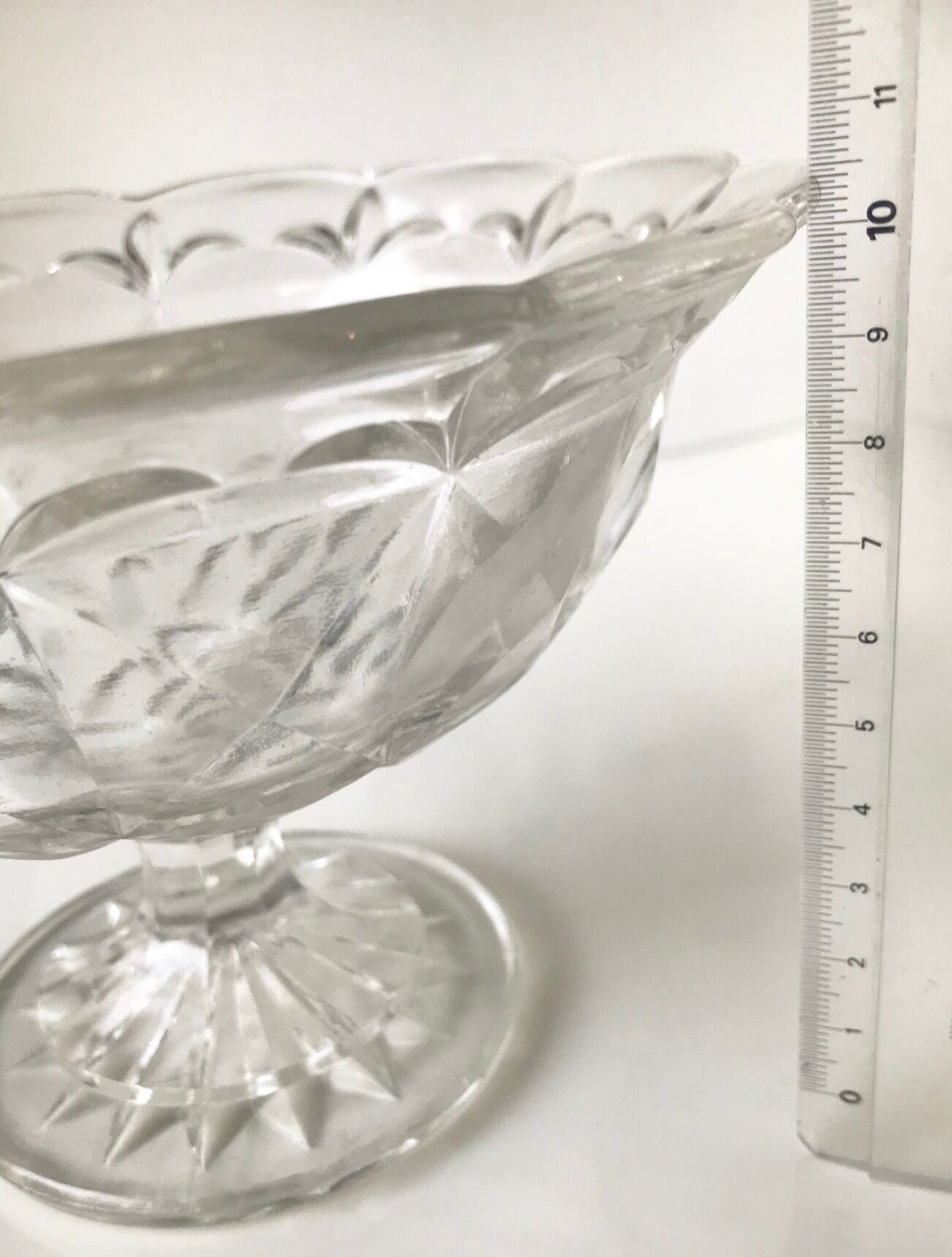 Old cut on foot faceted glass