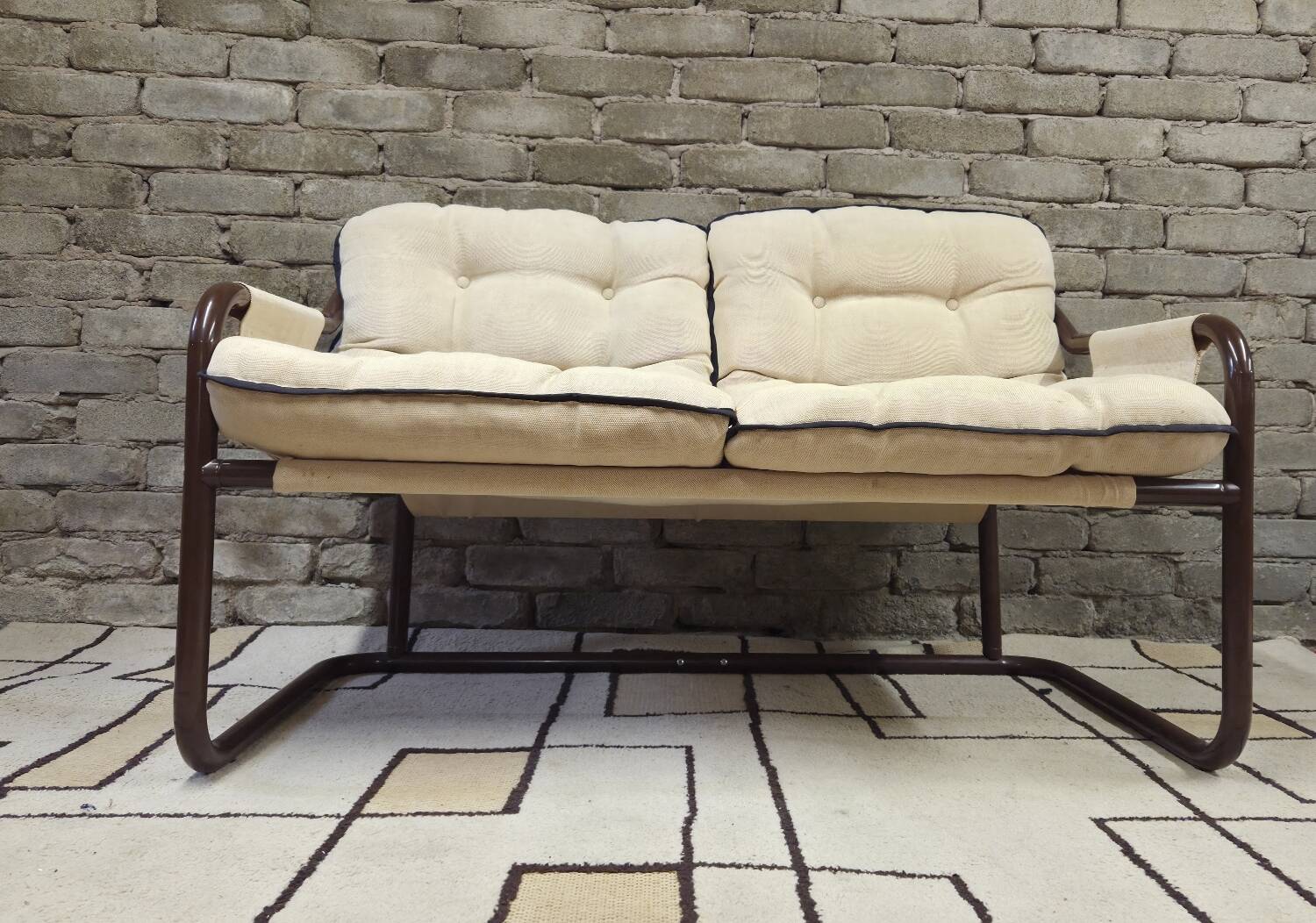 Tubular two-seater bench from the 1970s.