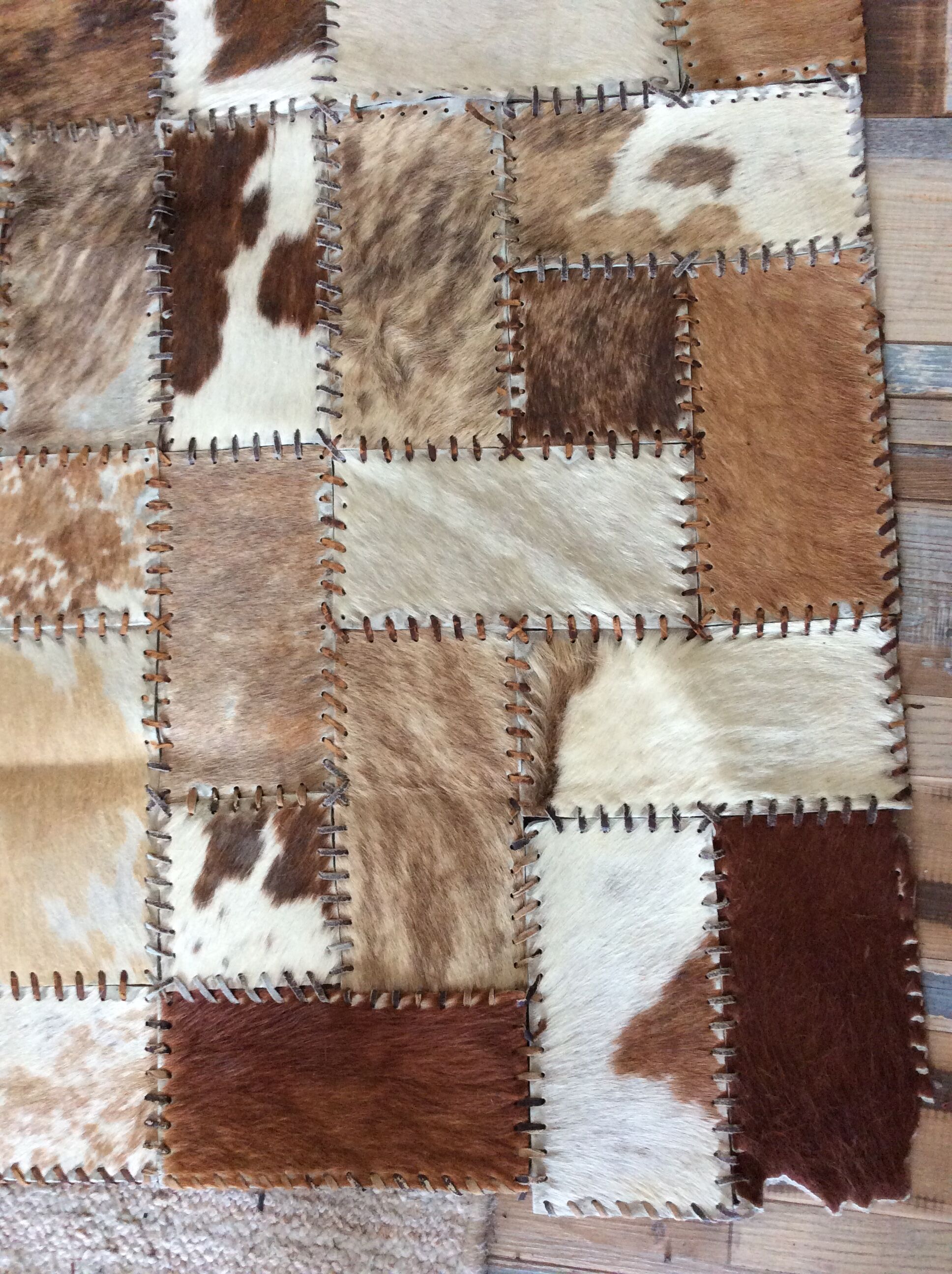 Patchwork carpet in cowhide 164x105cm from the 70s