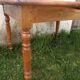 Round drop-leaf table in beech and pine