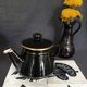 Black and gold ceramic coffee maker