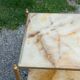 Pair of neoclassical side tables in bronze, brass, marble, and o.