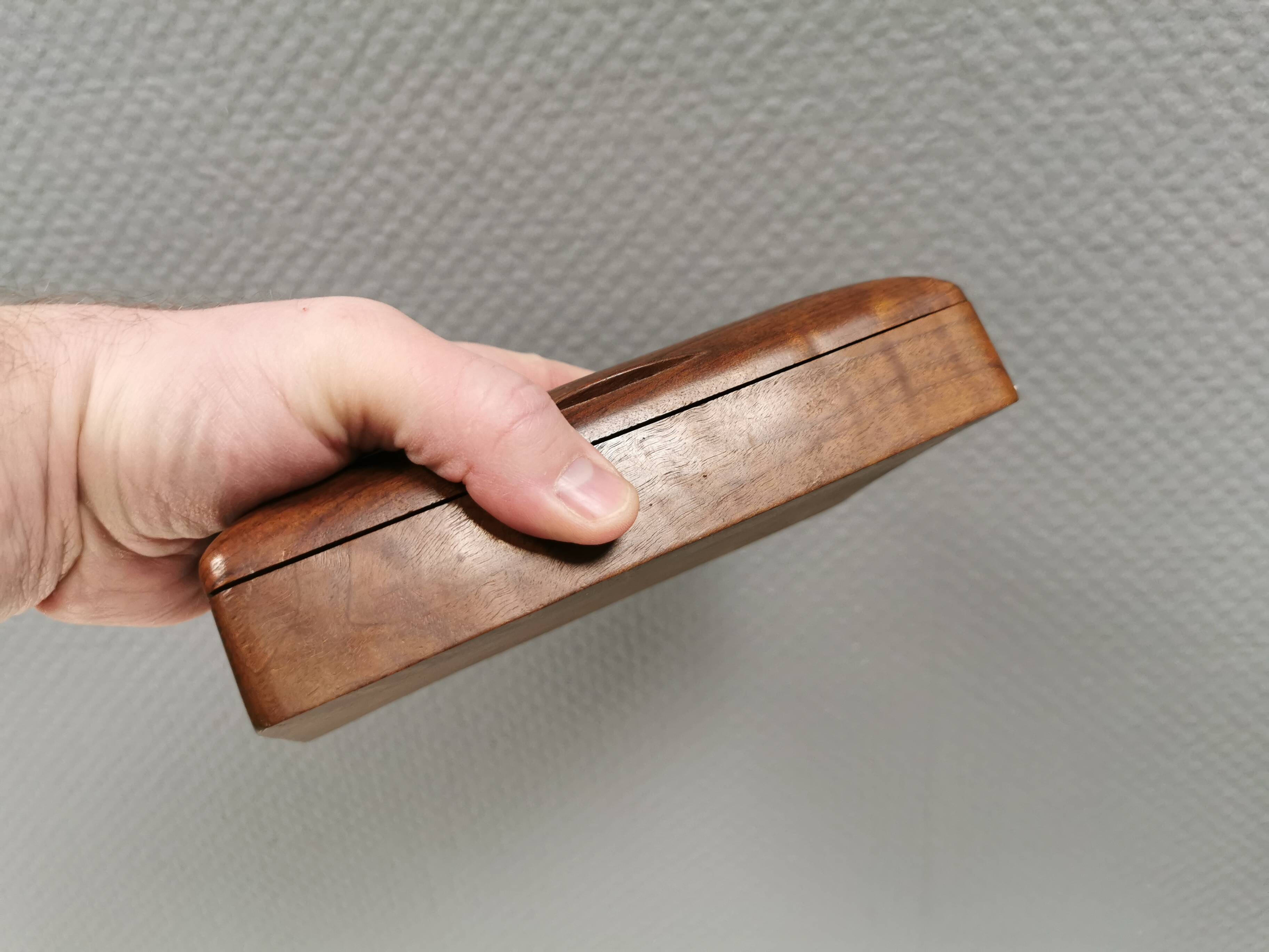 Wooden trinket box for storing jewellery, cigarettes or similar items.