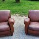 Paire de fauteuils club en cuir brun des années 30