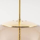 Large Limburg pendant light in brass with smoked glass ball, Germany, 1970s.