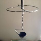 Designer umbrella stand in chrome metal and wood.