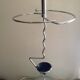 Designer umbrella stand in chrome metal and wood.