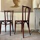 2 bistro chairs in arched and dark wood