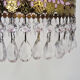 Vintage rose pendant light with pendants and patterned glass globe.