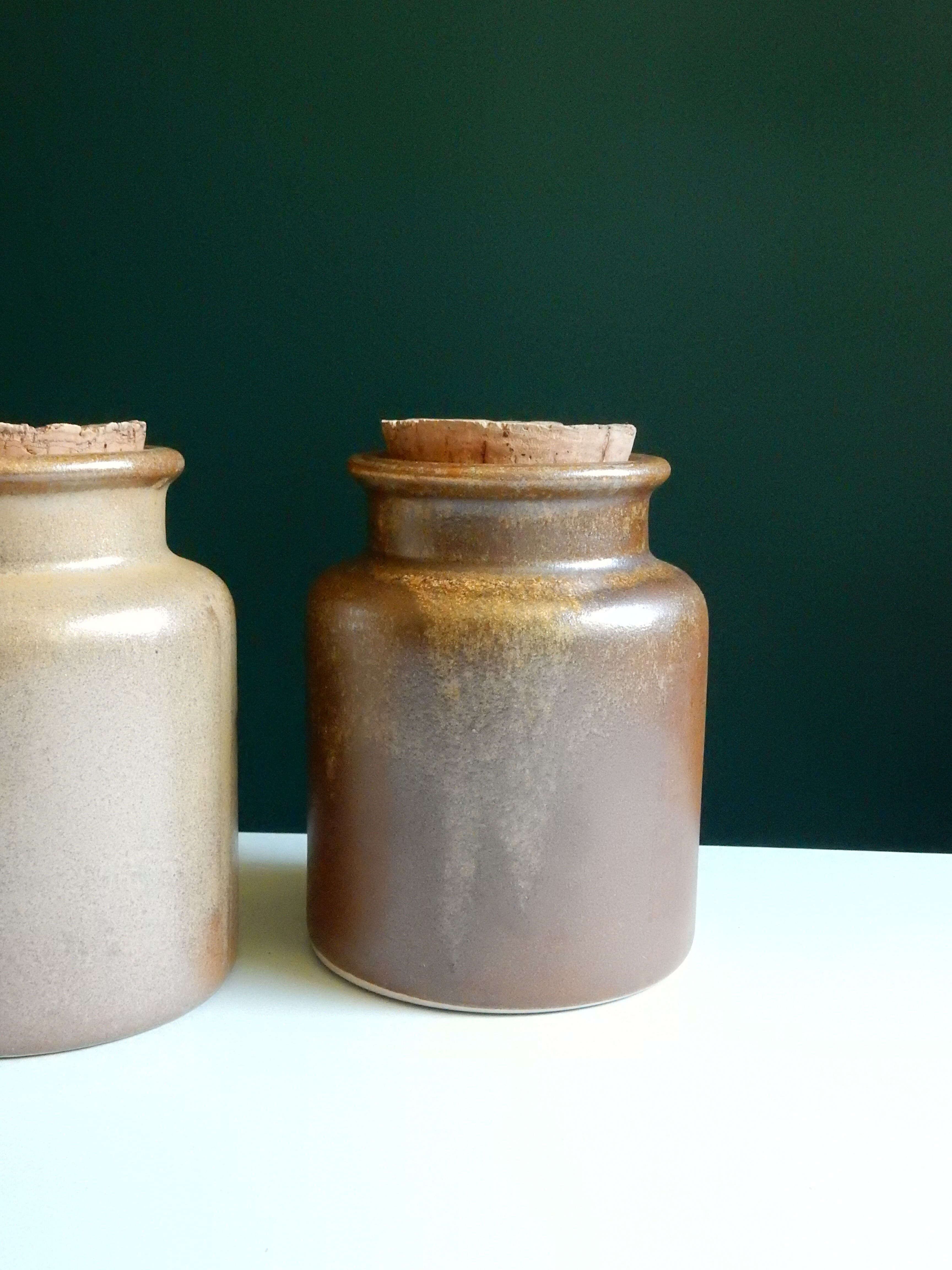 2 brown sandstone mustard pots