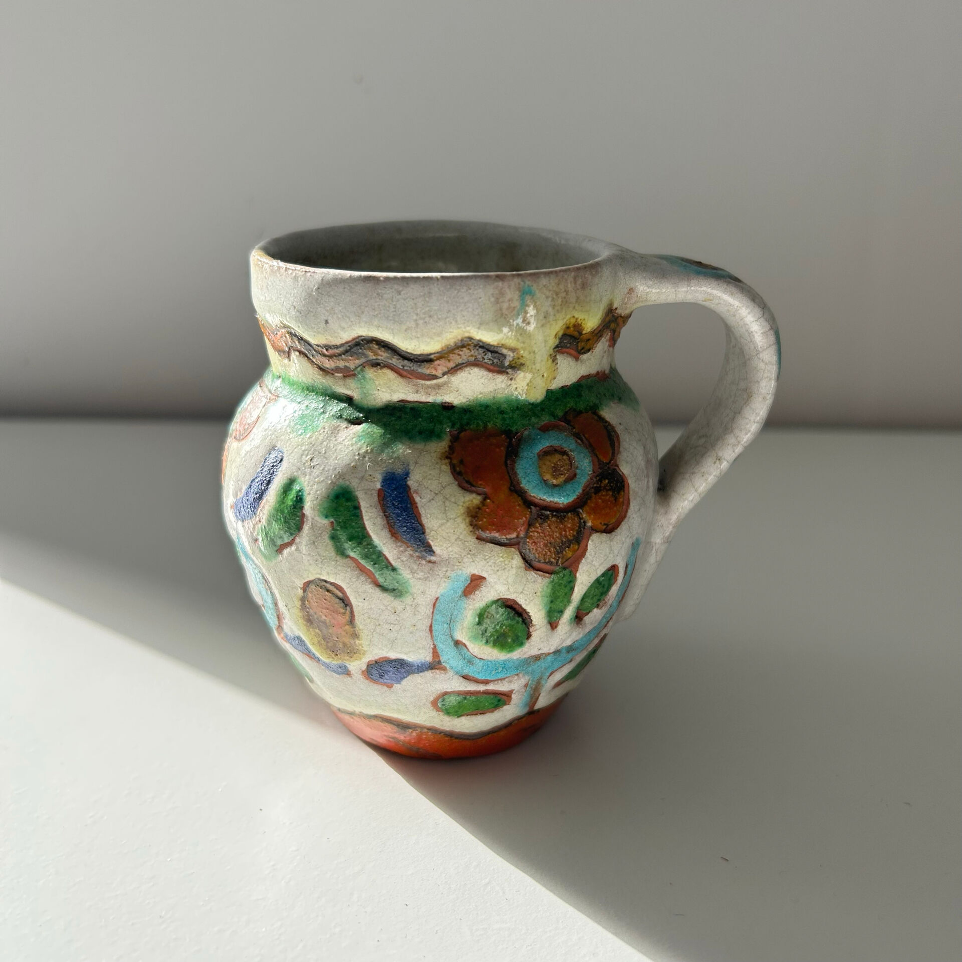 Small floral jug signed