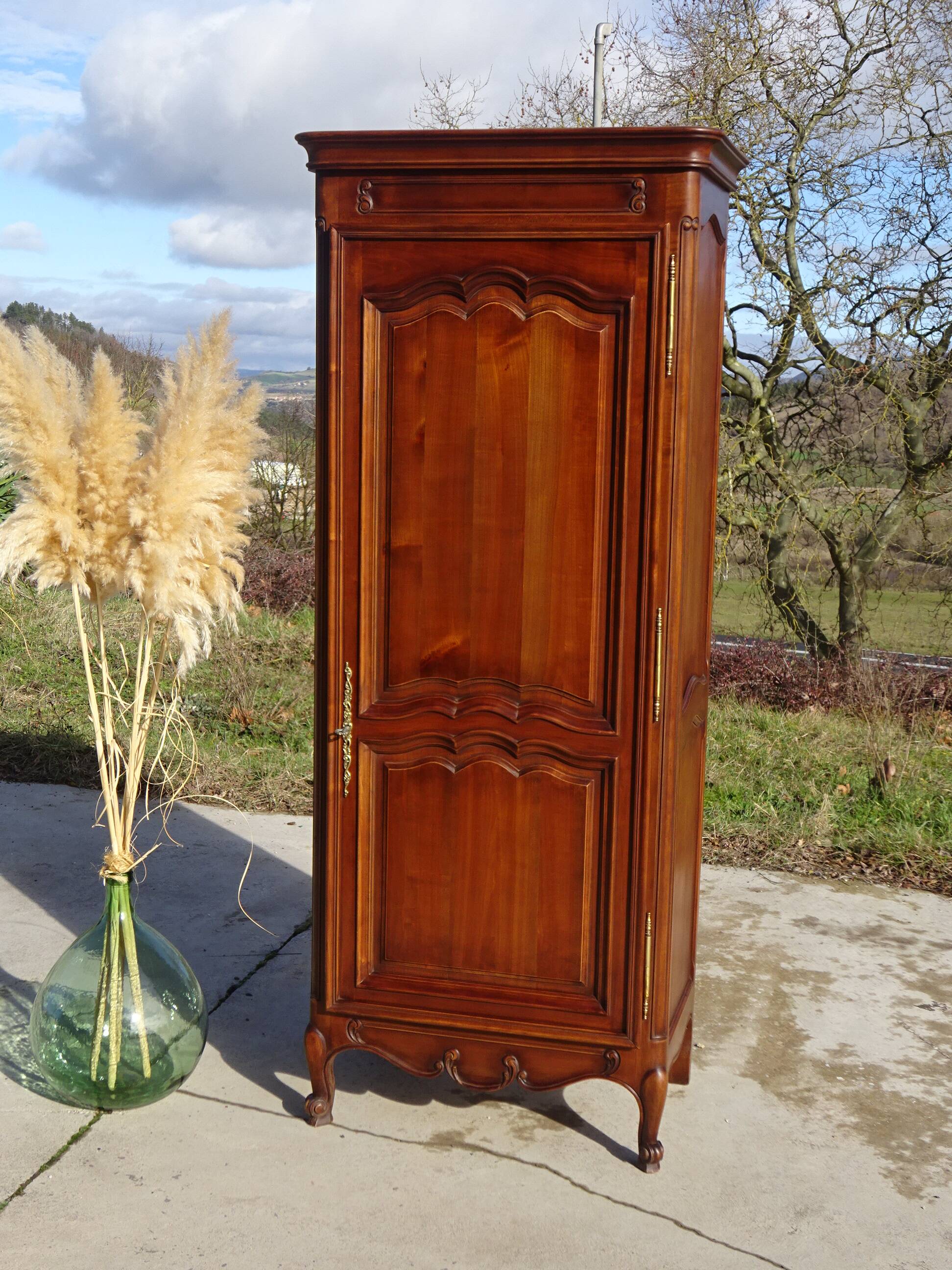 Louis XV style bonnetière in solid cherry wood